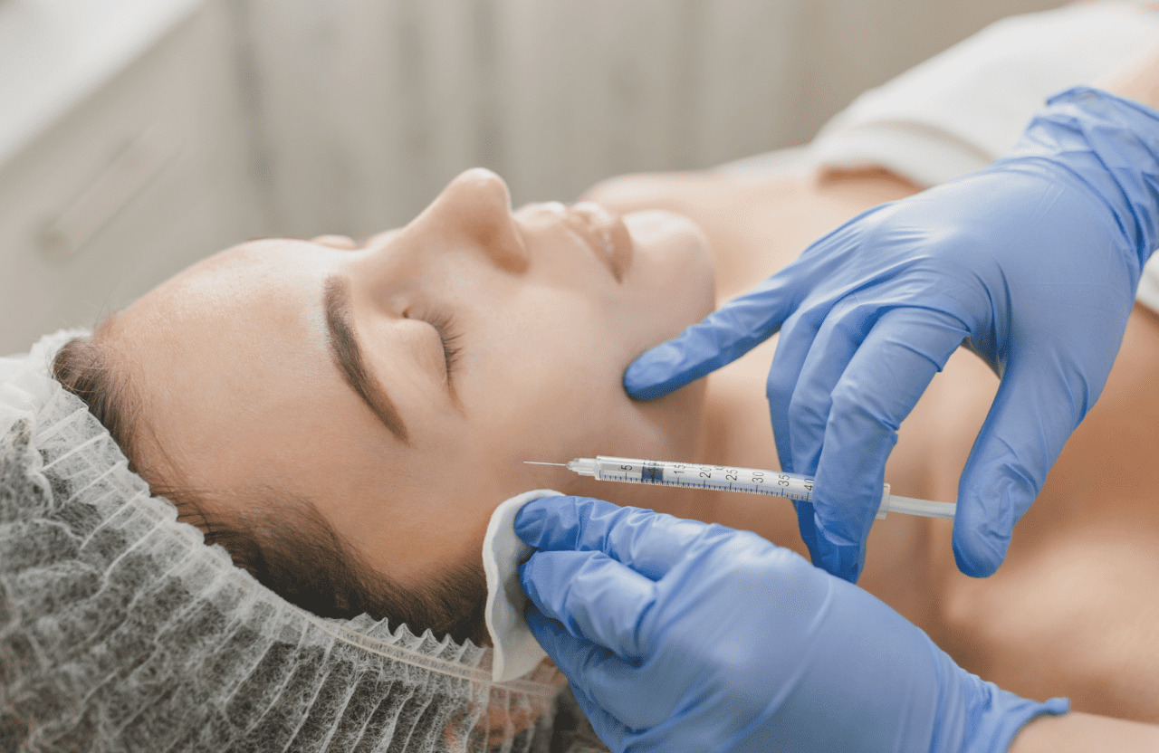 patient getting an injection into the cheek