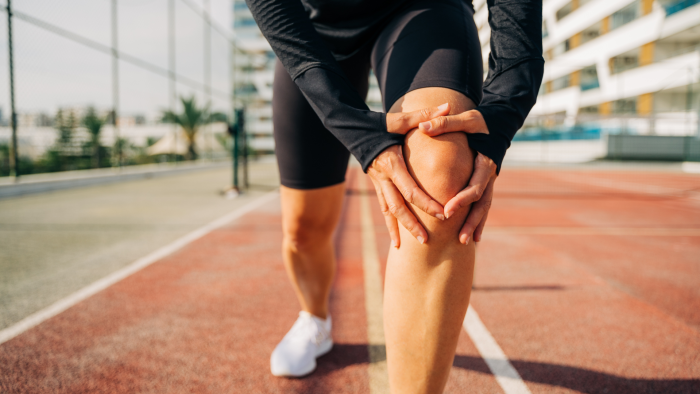 Person holding their knee.