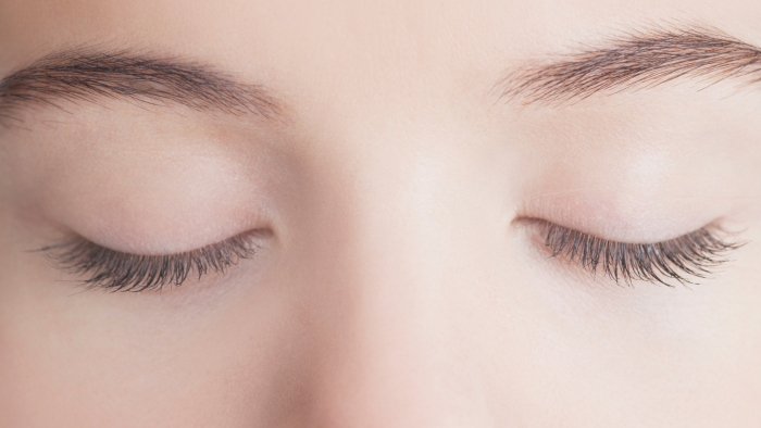 A woman with rejuvenated under eyes, exuding confidence
