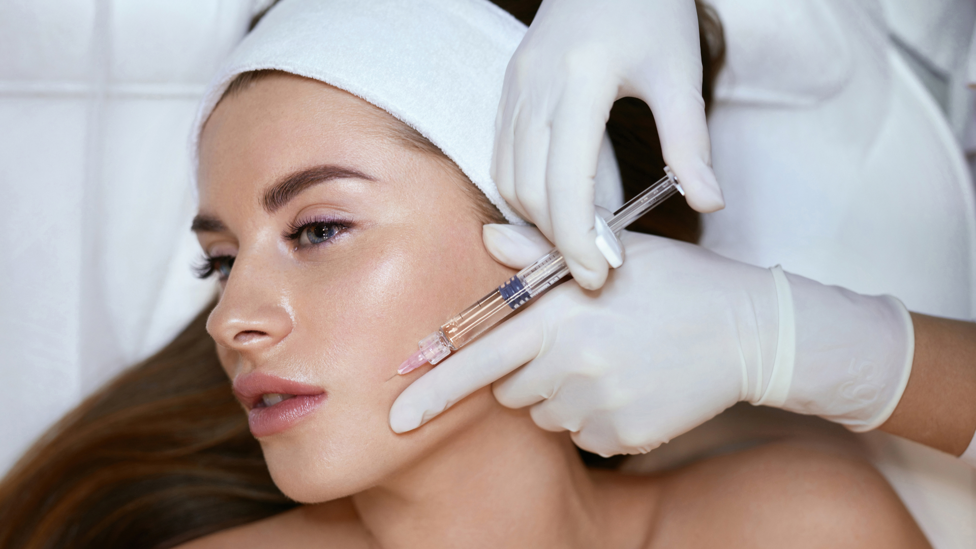 Woman getting facial injection.