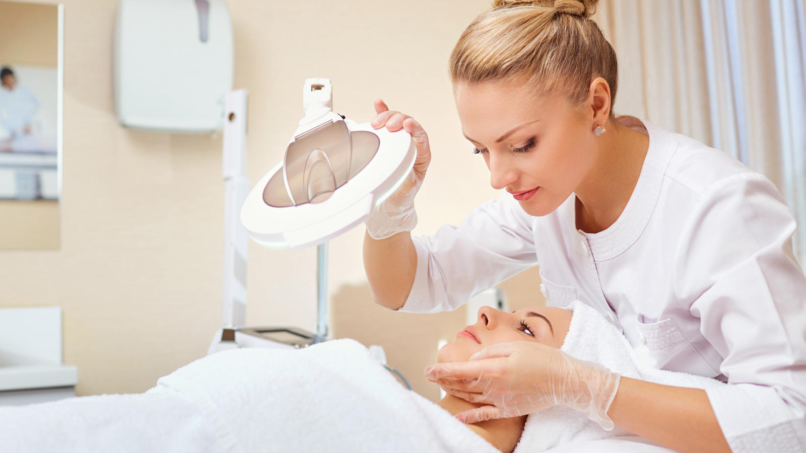 A healthcare professional carefully assesses a patient's facial structure before injecting Restylane.