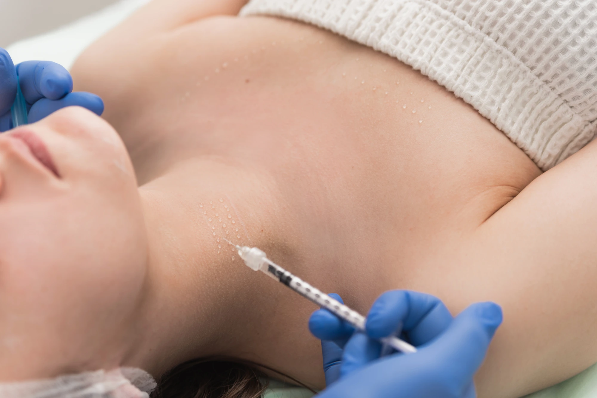 woman getting filler in the neck for neck wrinkles treatment