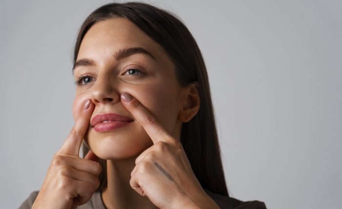 portrait young woman practicing facial yoga youth