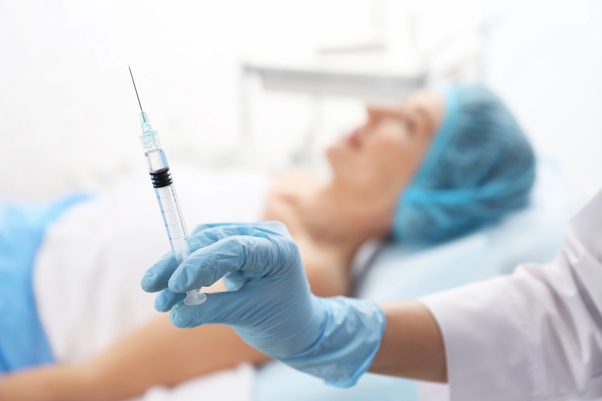 closeup on a surringe with a lip filler