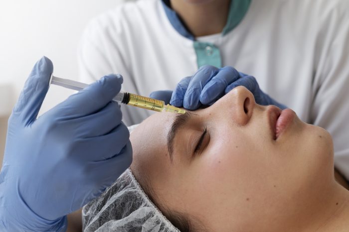 woman getting face prp treatment close up