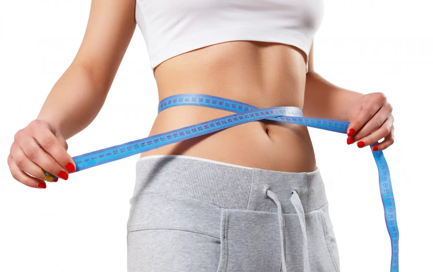 Woman uses a tape measure to track improved health and weight loss Mounjaro results.