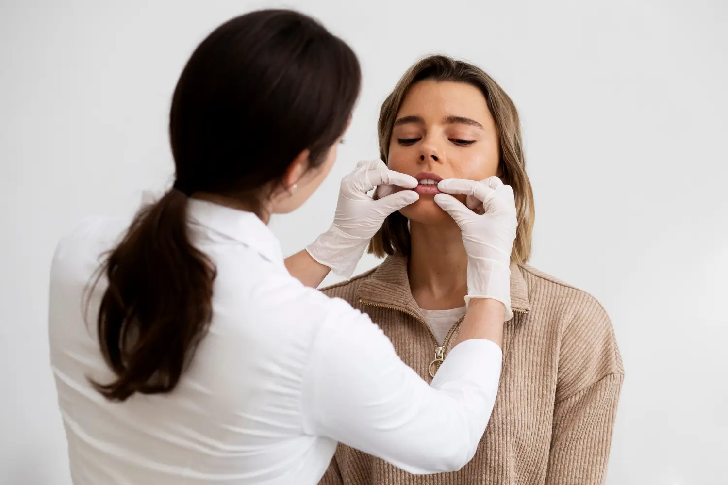 checking the progress of lip augmentation with filler