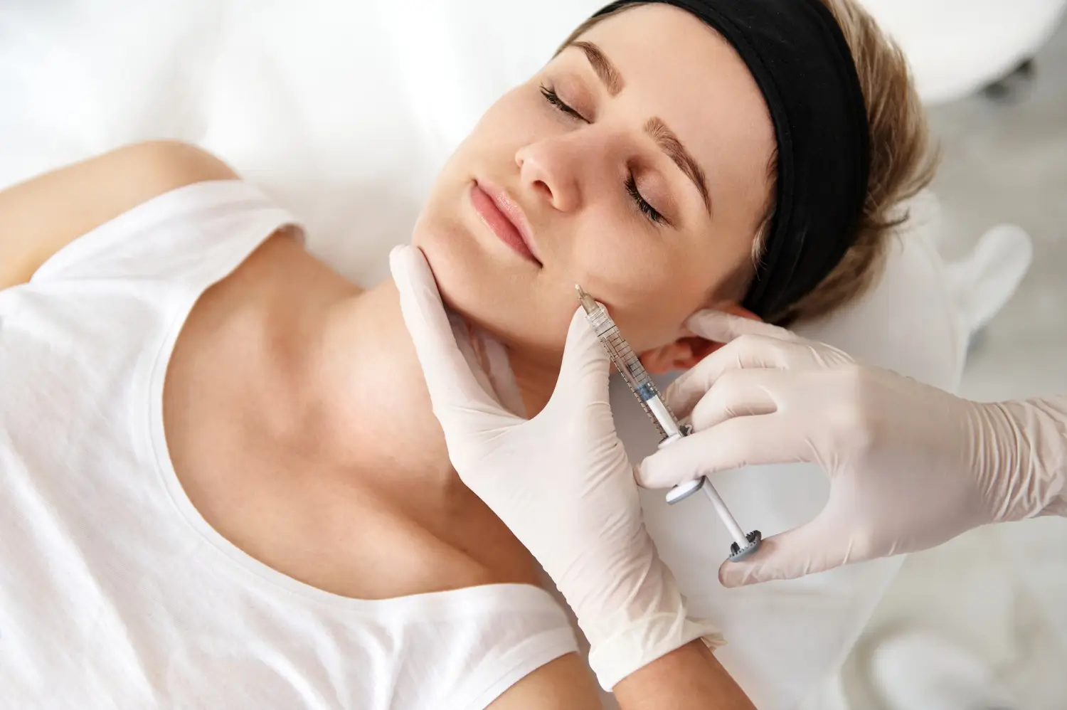 woman receiving injection for facial rejuvenation