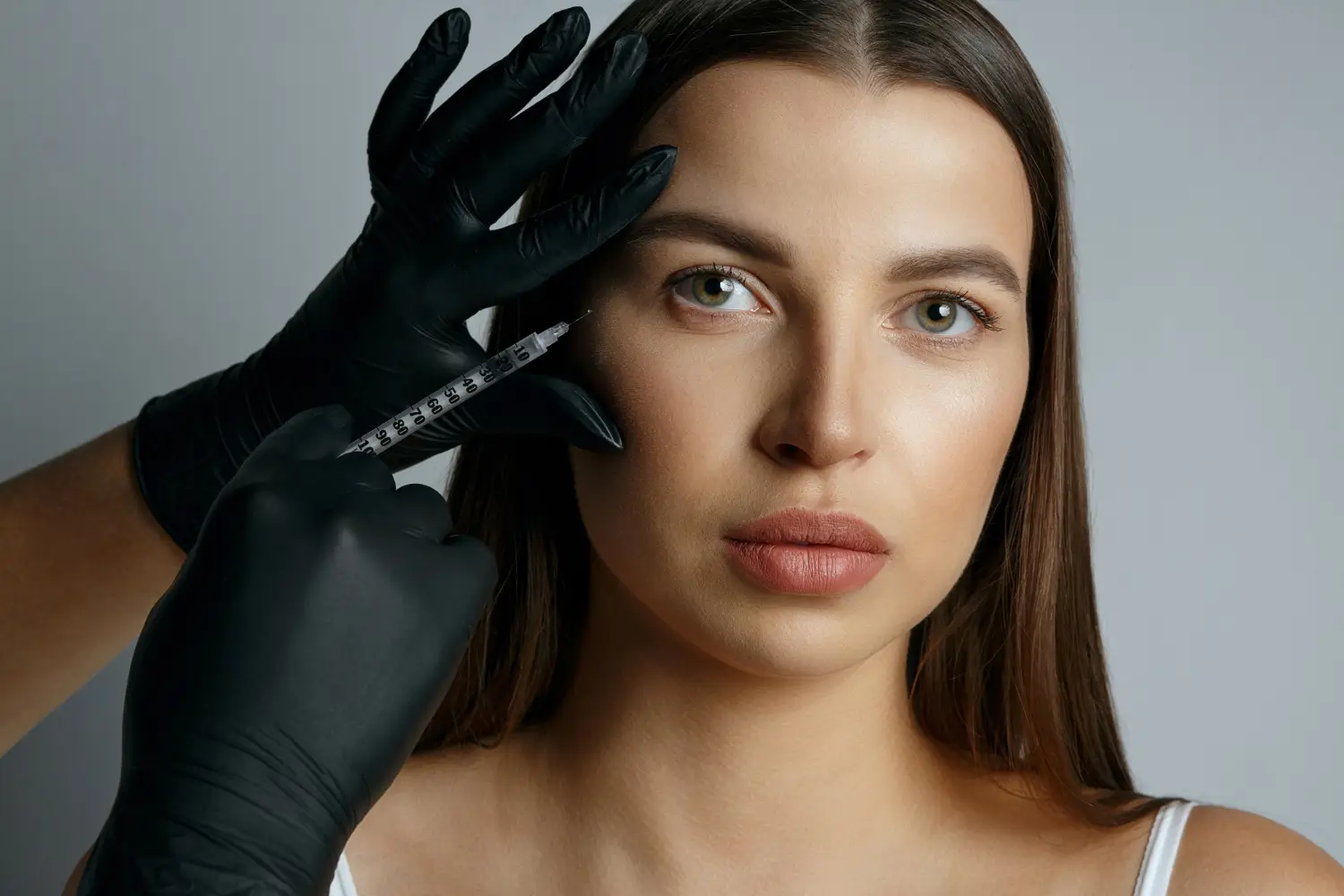 woman getting injection for crow's feet