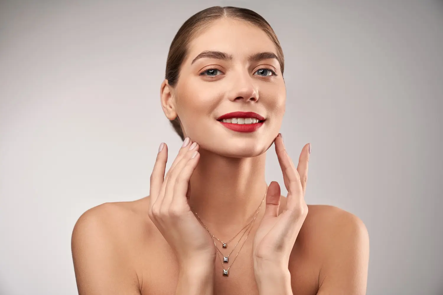 woman touching her face
