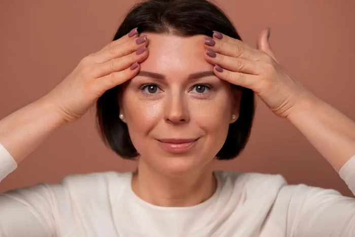 A woman happy with a wrinkle-free forehead