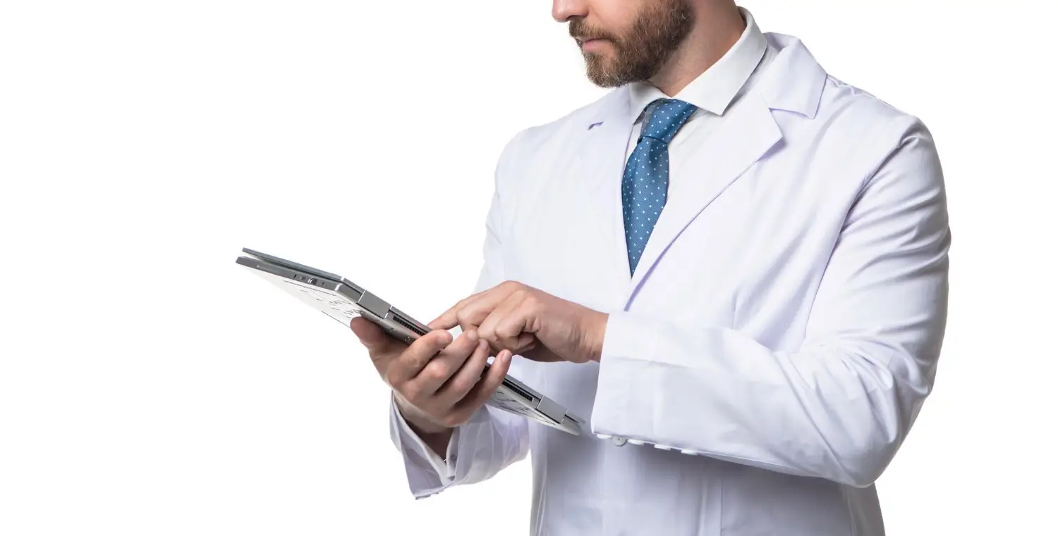 doctor reading the record of a patient's condition