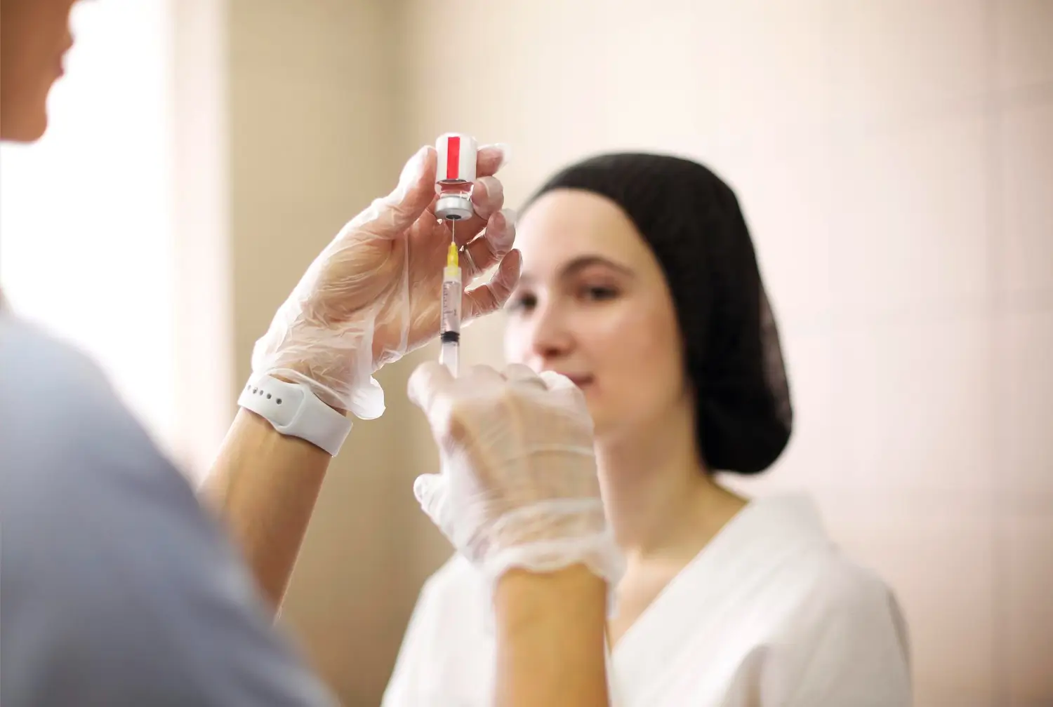 Doctor prepares the injection