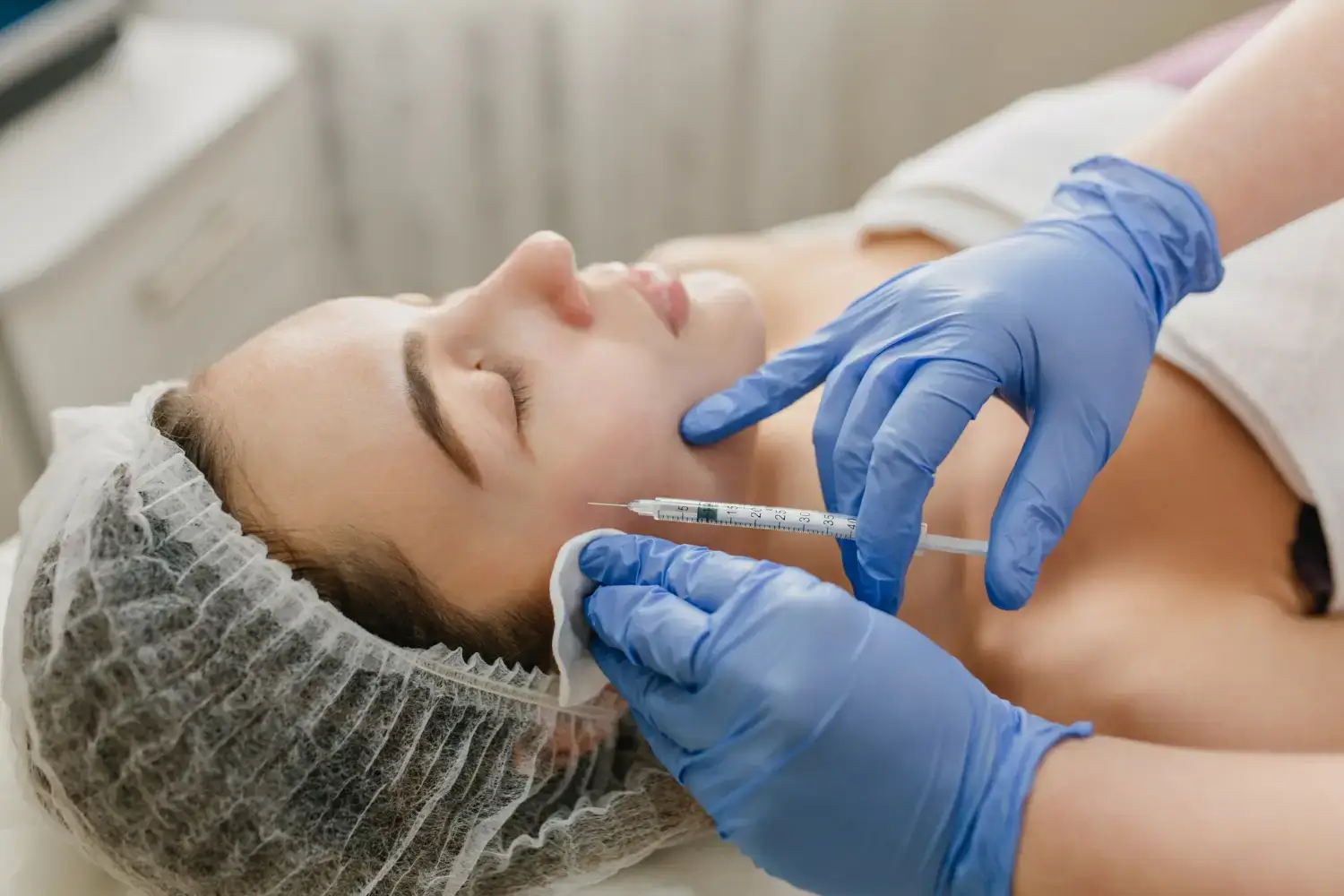 A female patient receives skin booster injections for rejuvenated skin.