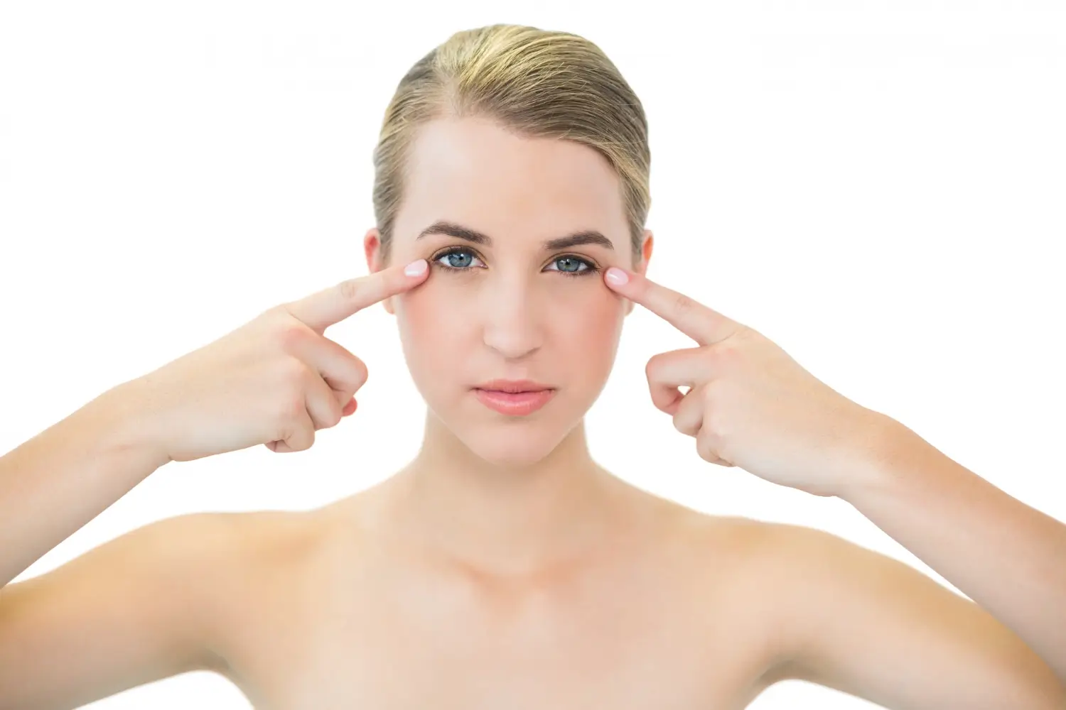 patient pointing to her under eye