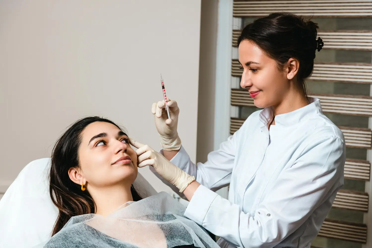 Nurse practitioner providing beauty treatment