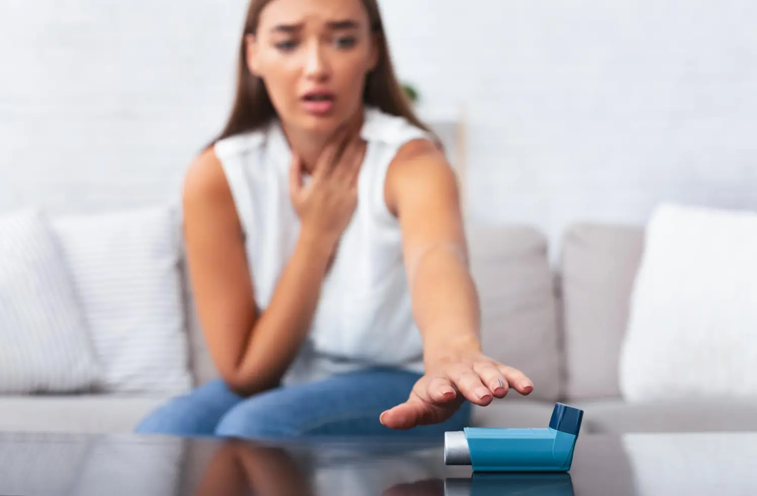 her asthma suddenly hits and she reaches for her inhaler