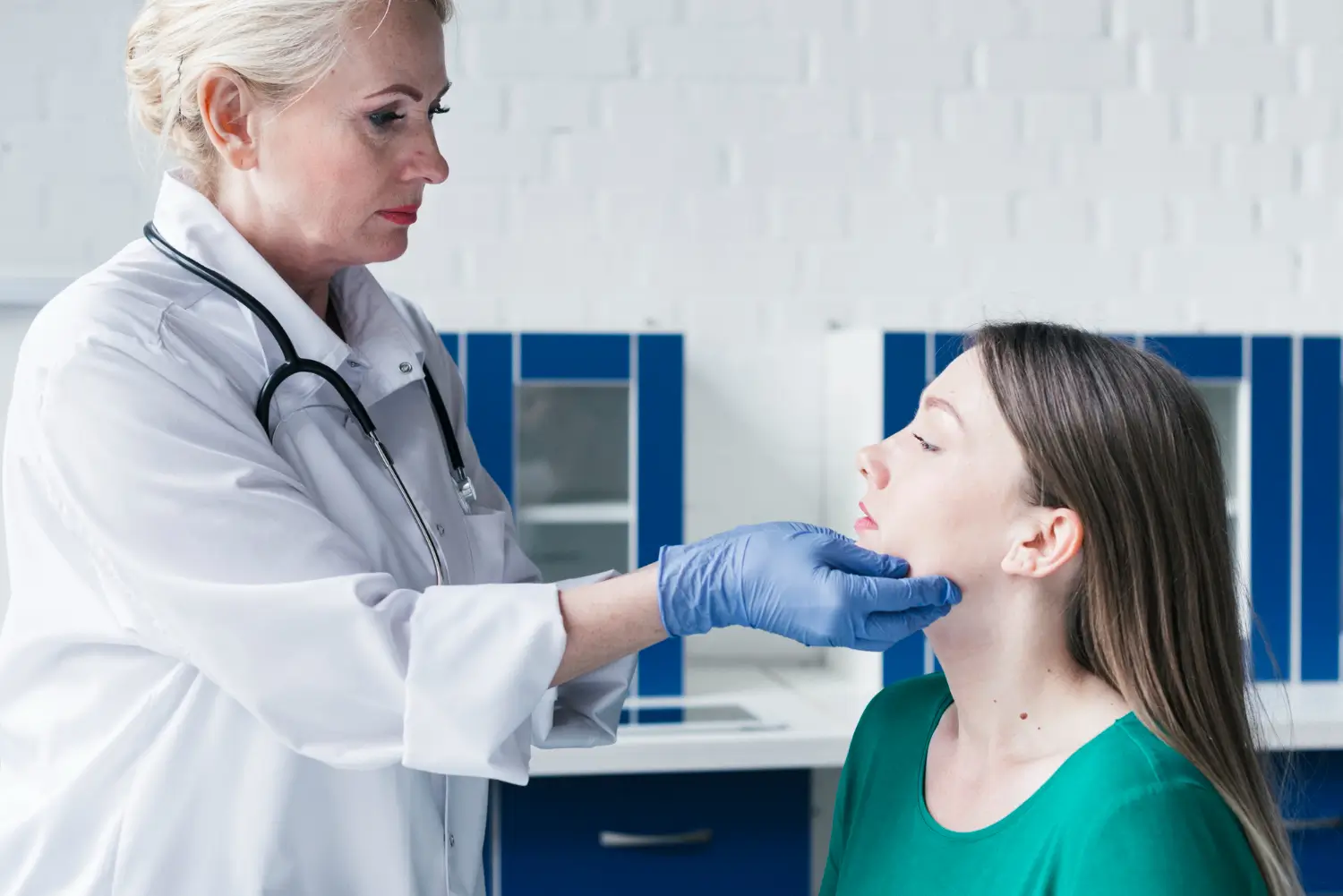 doctor examining patient's face
