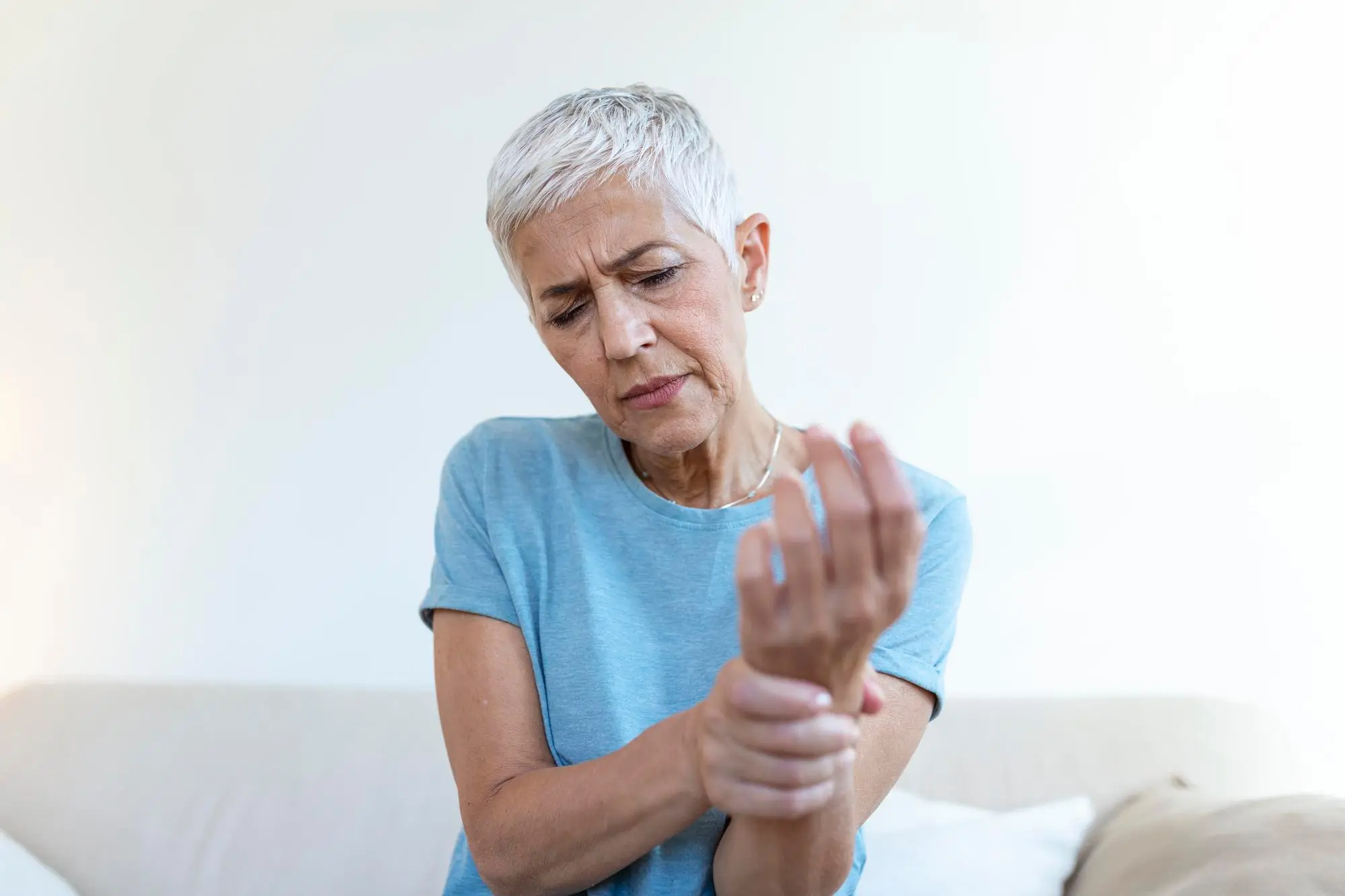 Woman feeling pain in joints
