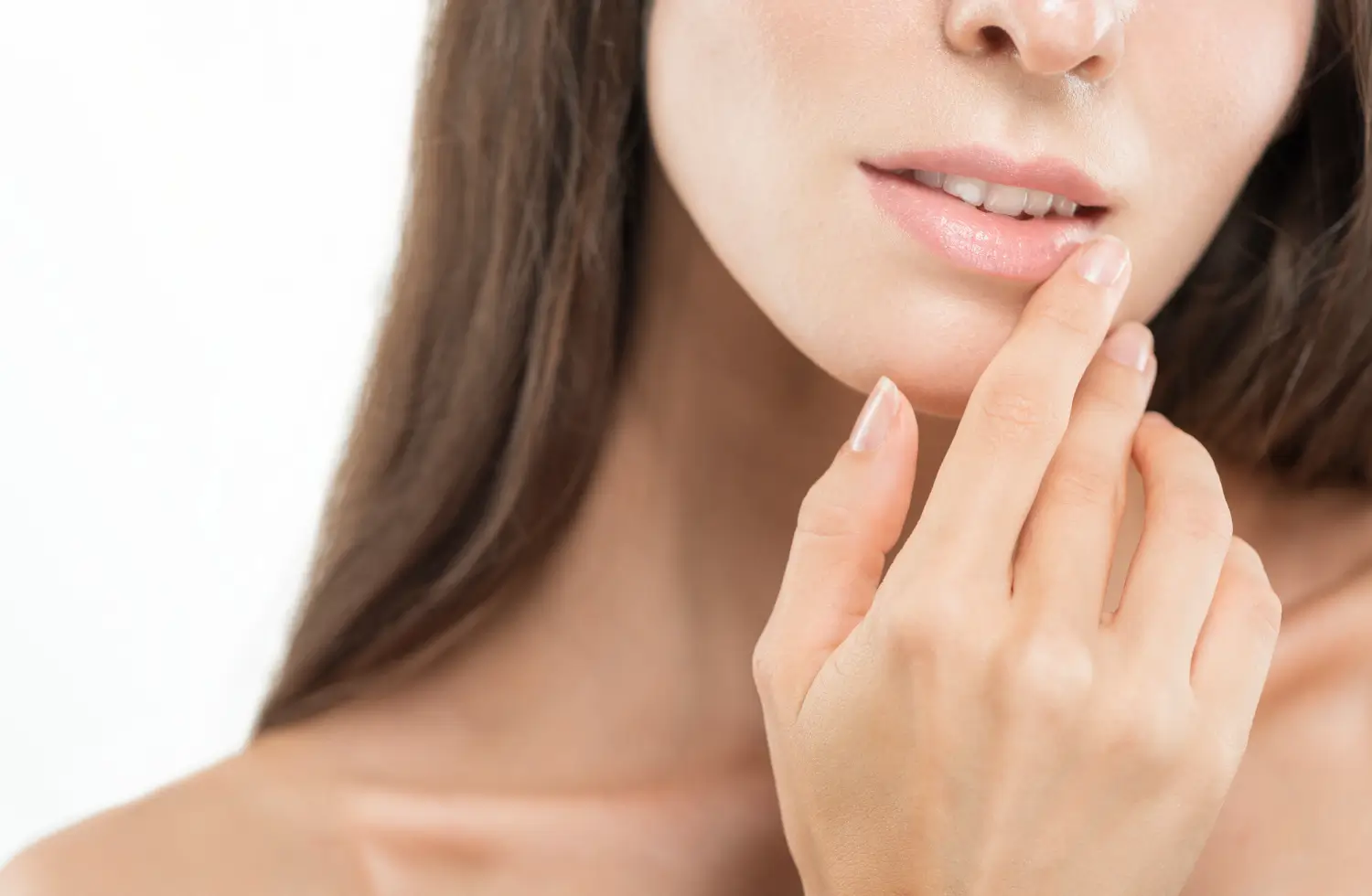 woman touches her lips and feels happy
