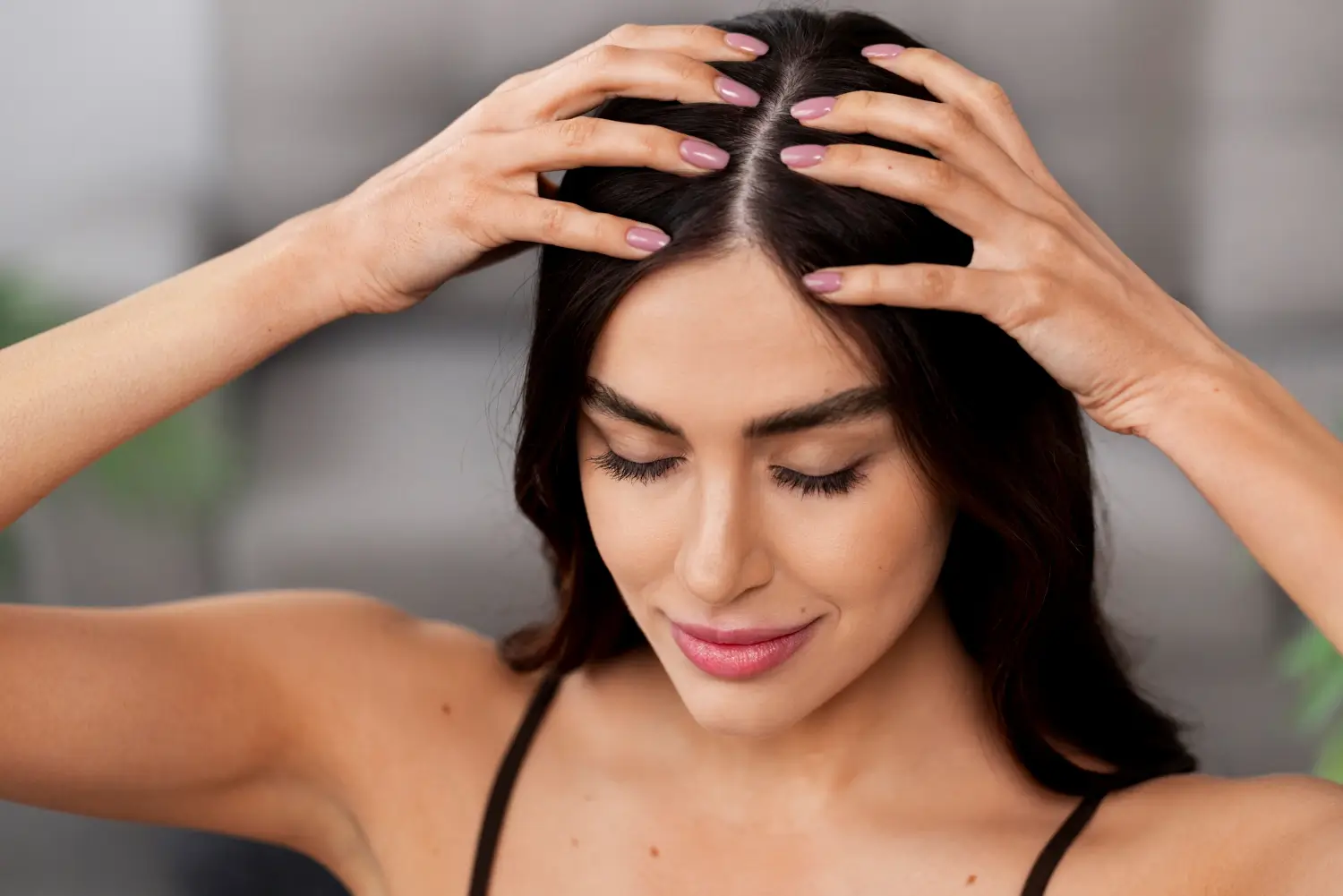 she massages her head for healthier and more relaxed scalp