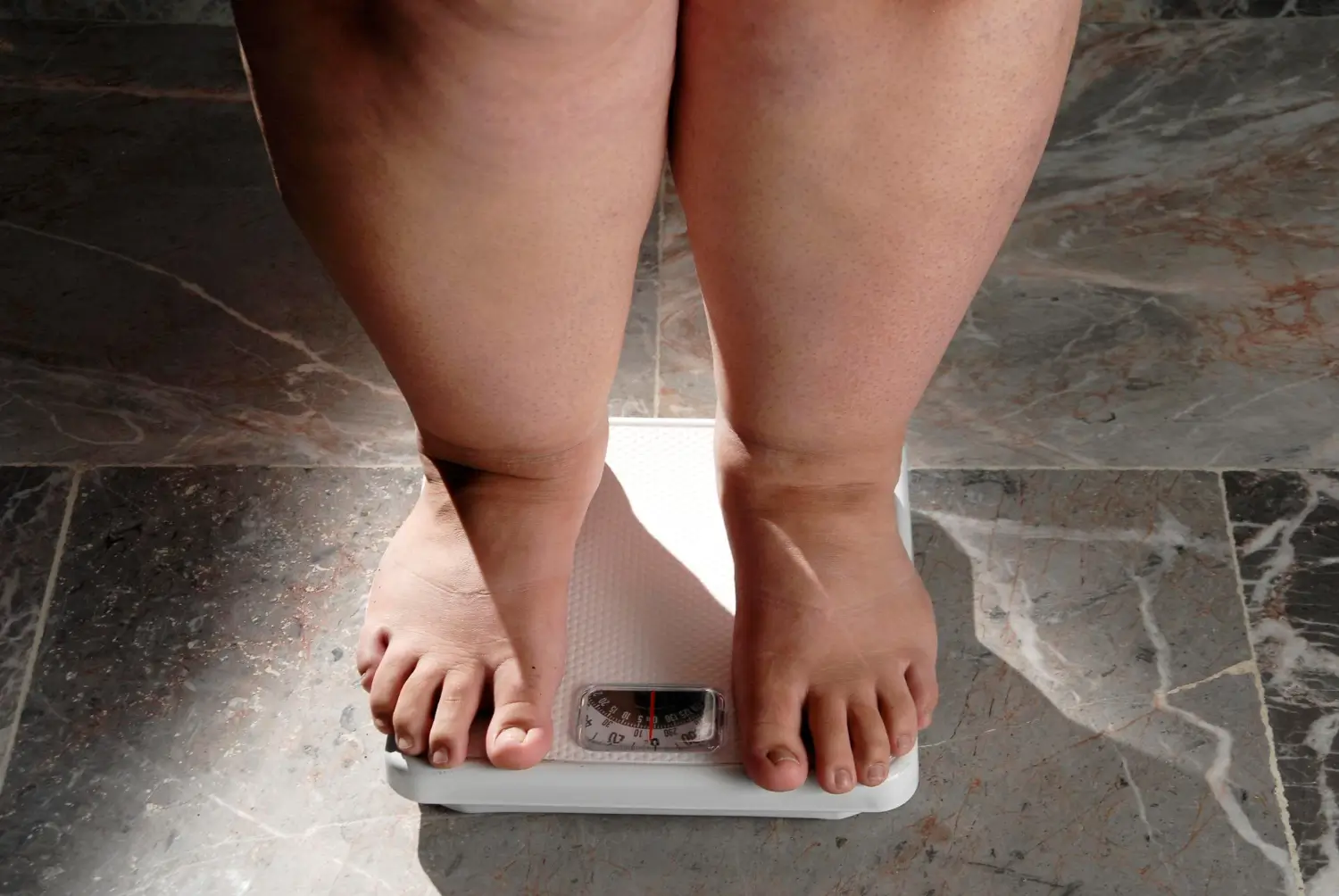 weighing how much weight she gained in a month