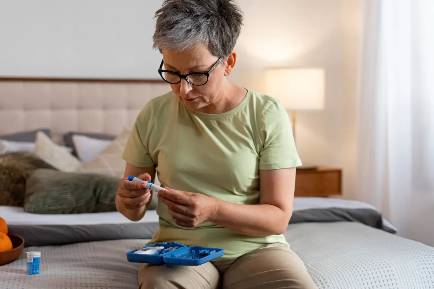 Woman preparing her insulin pen for easy, effective diabetes management and blood sugar control.