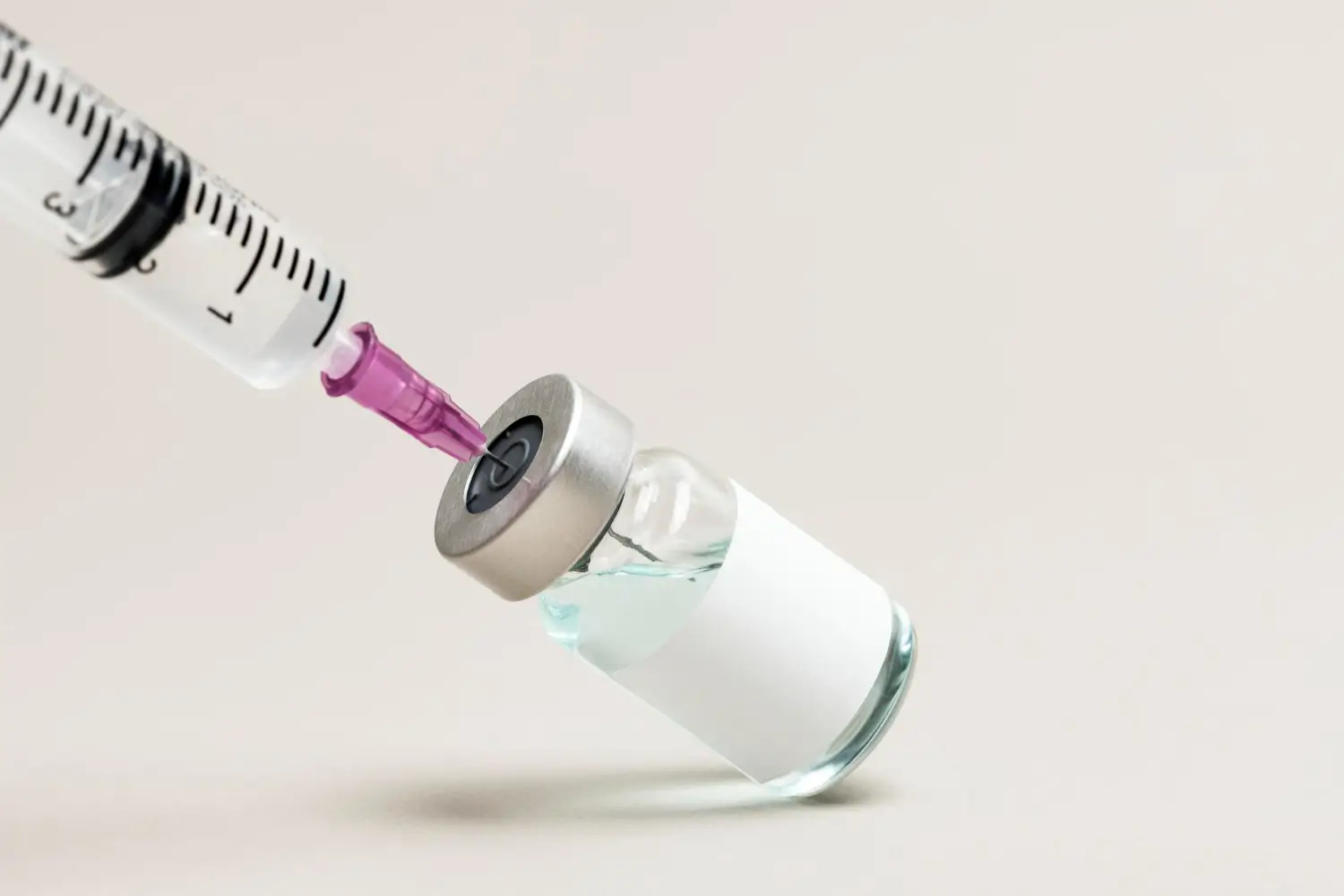 doctor prepares the injection for her patient