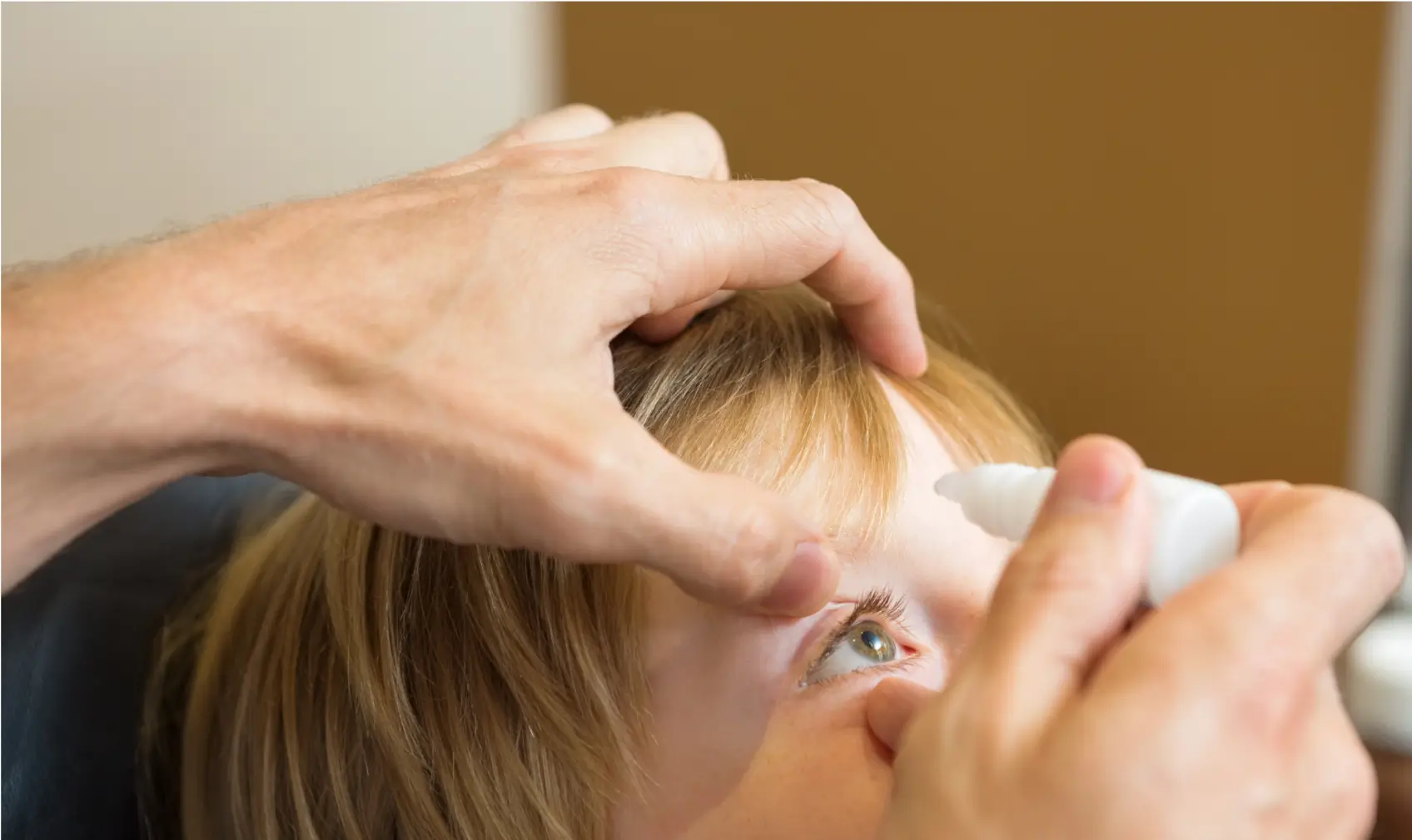 dropping an eye solution for the patient's glaucoma