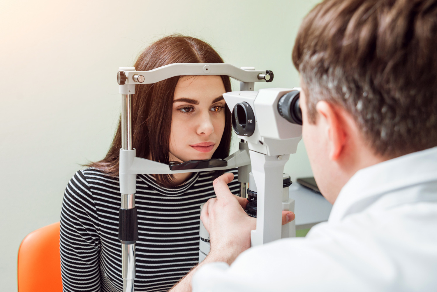 checking patient's eyes